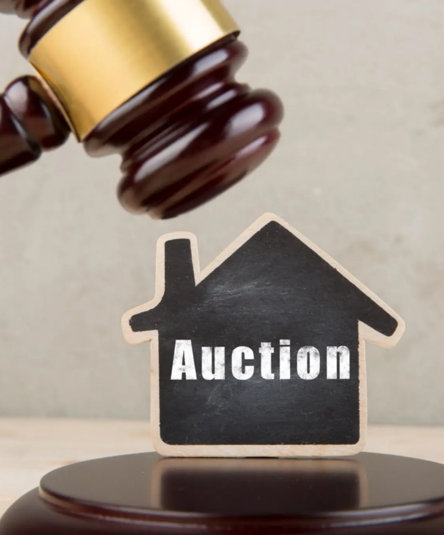 Gavel and house-shaped auction sign.